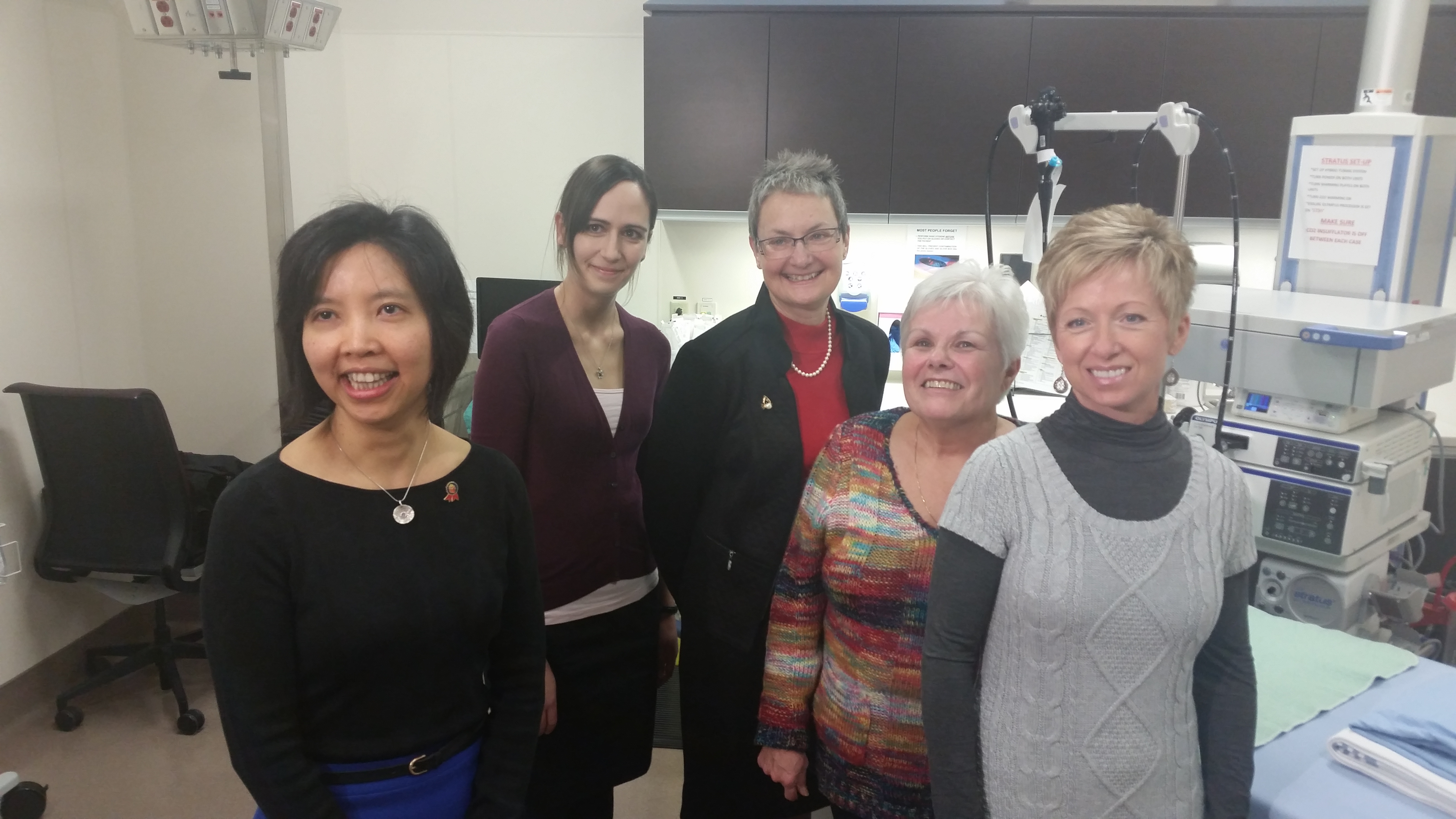 Dr. Dina Kao with her nurse, Brandi Roach, and patients Alexandra Hildebrandt, Susan Brothen and Lora Rode
