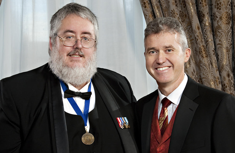 Austin Mardon (left) with Christopher Doig, then-president of the Alberta Medical Association.