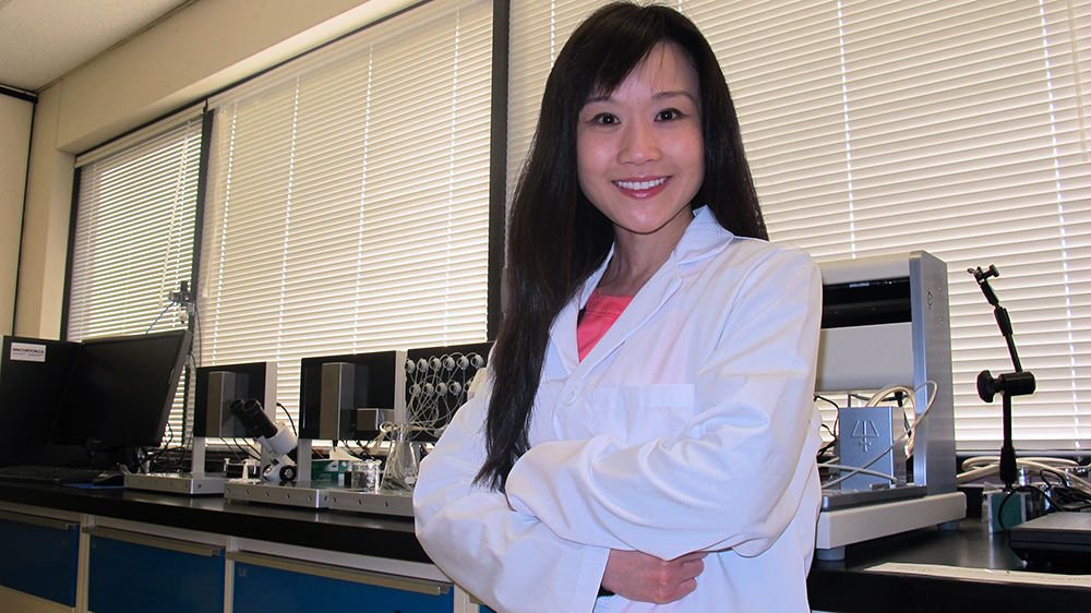 Jessica Yue poses in her lab.